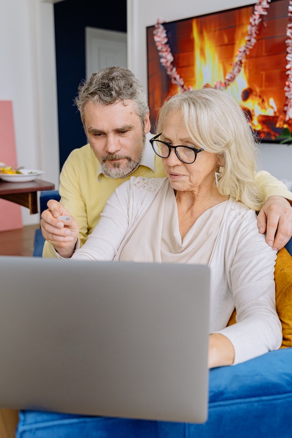 Elderly couple struggling to navigate a website that is not ADA complaint