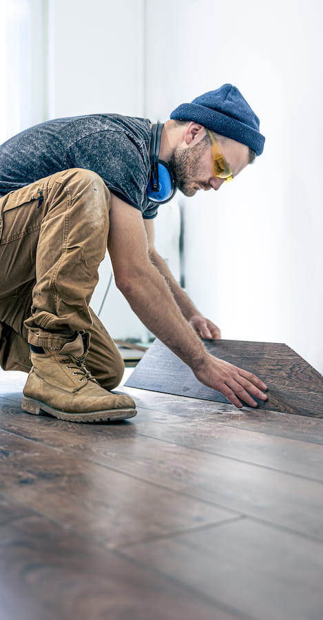 Working installing floor boards