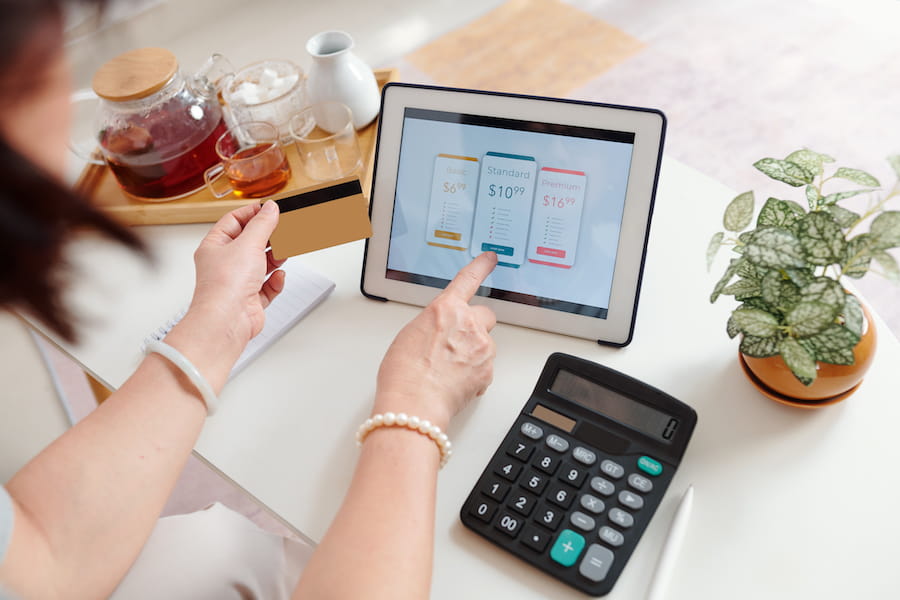 Homeowner using an interactive pricing calculator to estimate the cost of a home remodeling project online.