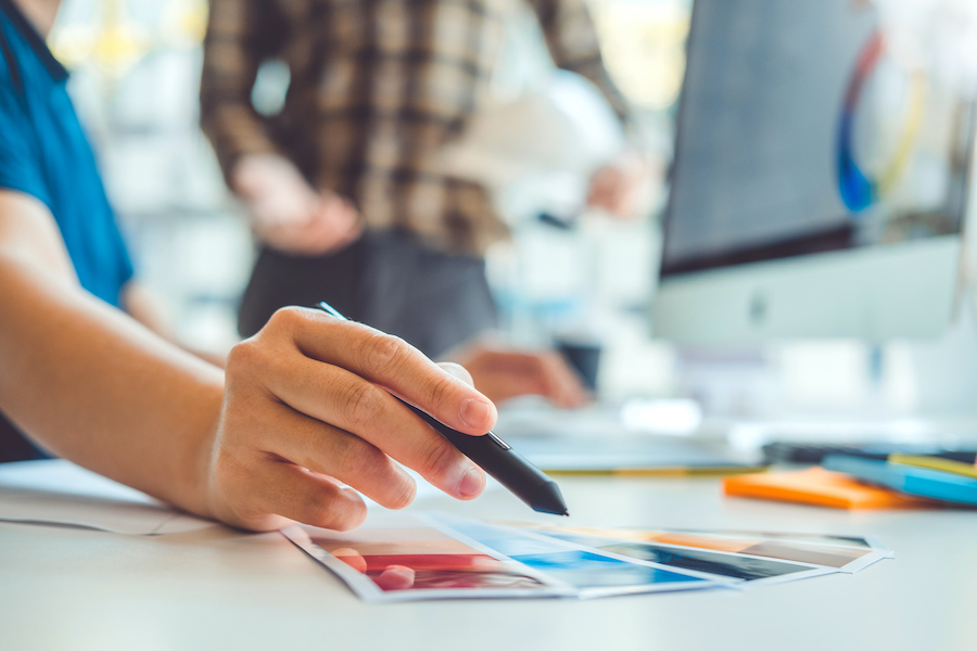 Designers Working with Color Palettes in Modern Workplace